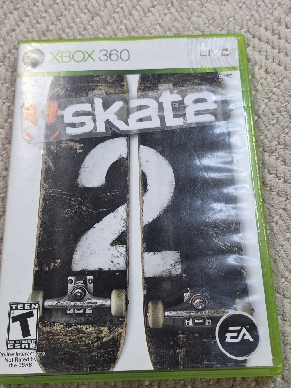 Microsoft Xbox 360 Skate 2 Game Case with White and Green Accents